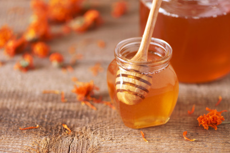 gallery/herbal-honey-in-jar-with-dipper-honeycomb-bee-poll-EUG28KB